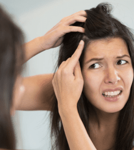Girl realizing her grey hairs